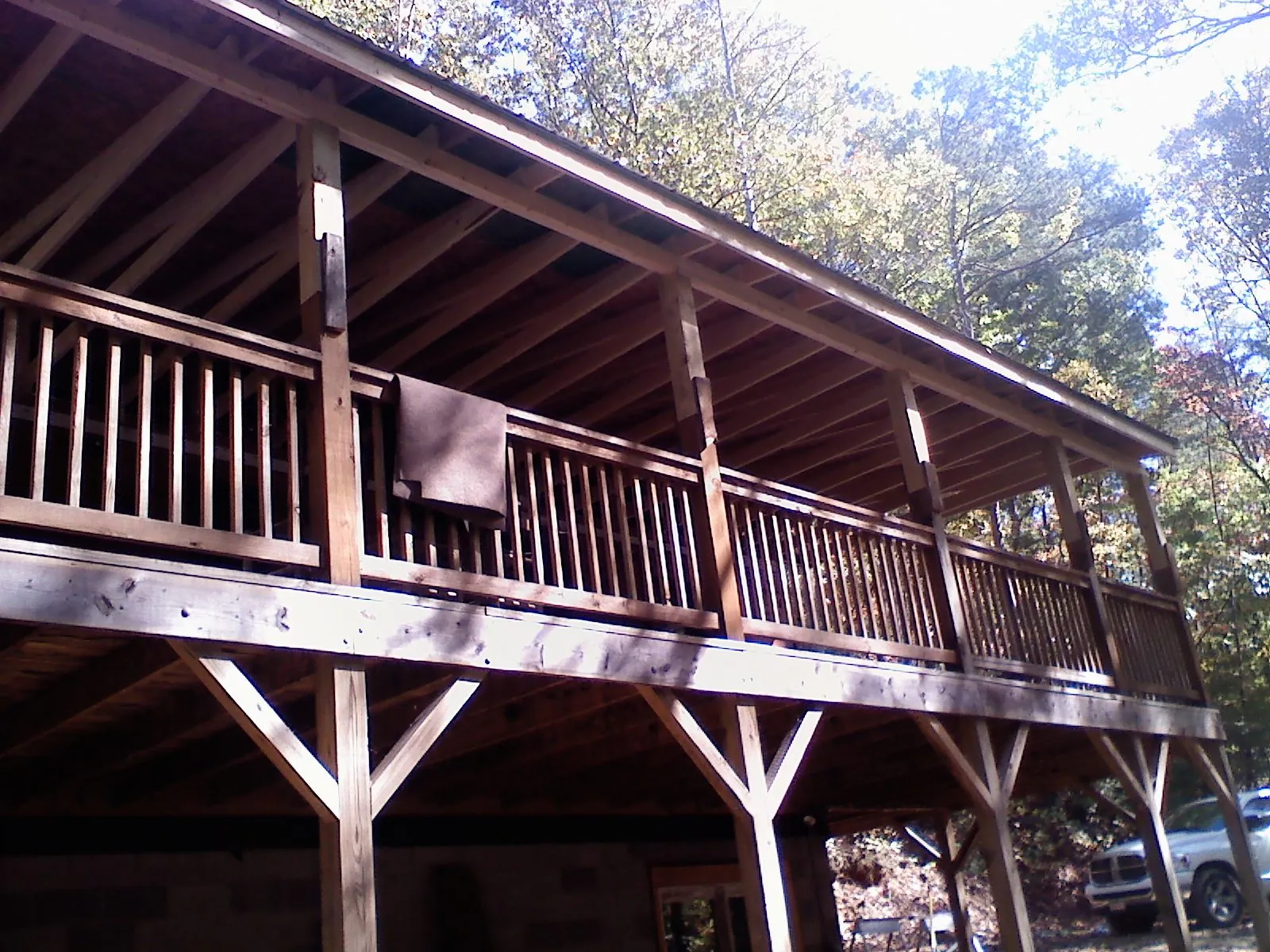 Timber framing under a new elevated porch and deck — Roof Leak Repair in West Farmington by Roofing Brothers